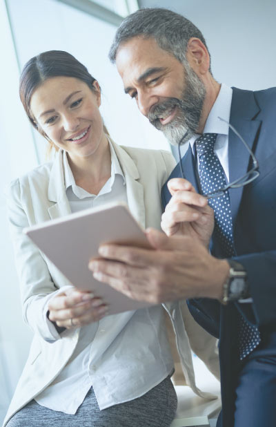 Two professionals observing an iPad